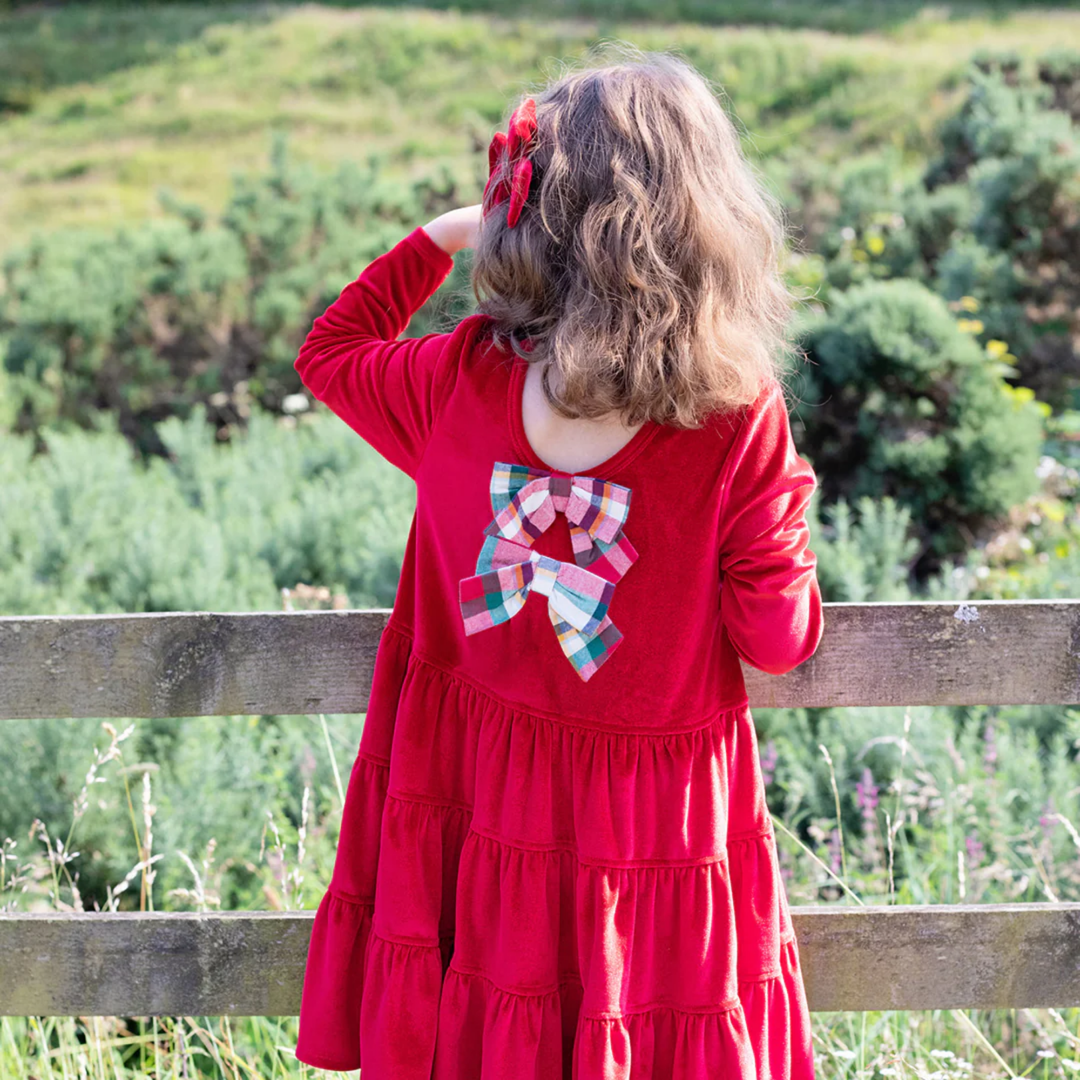 a girl wearing Velour Pearl Dress - Red