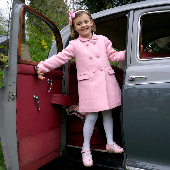 a girl wearing Velvet Trim Dress Coat in Pink