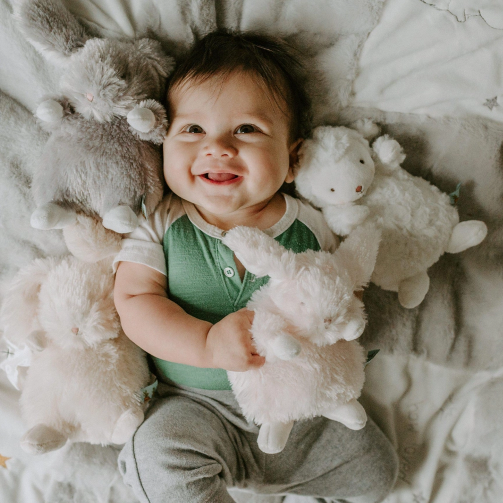 a baby hugging the Wee Rutabaga Bunny