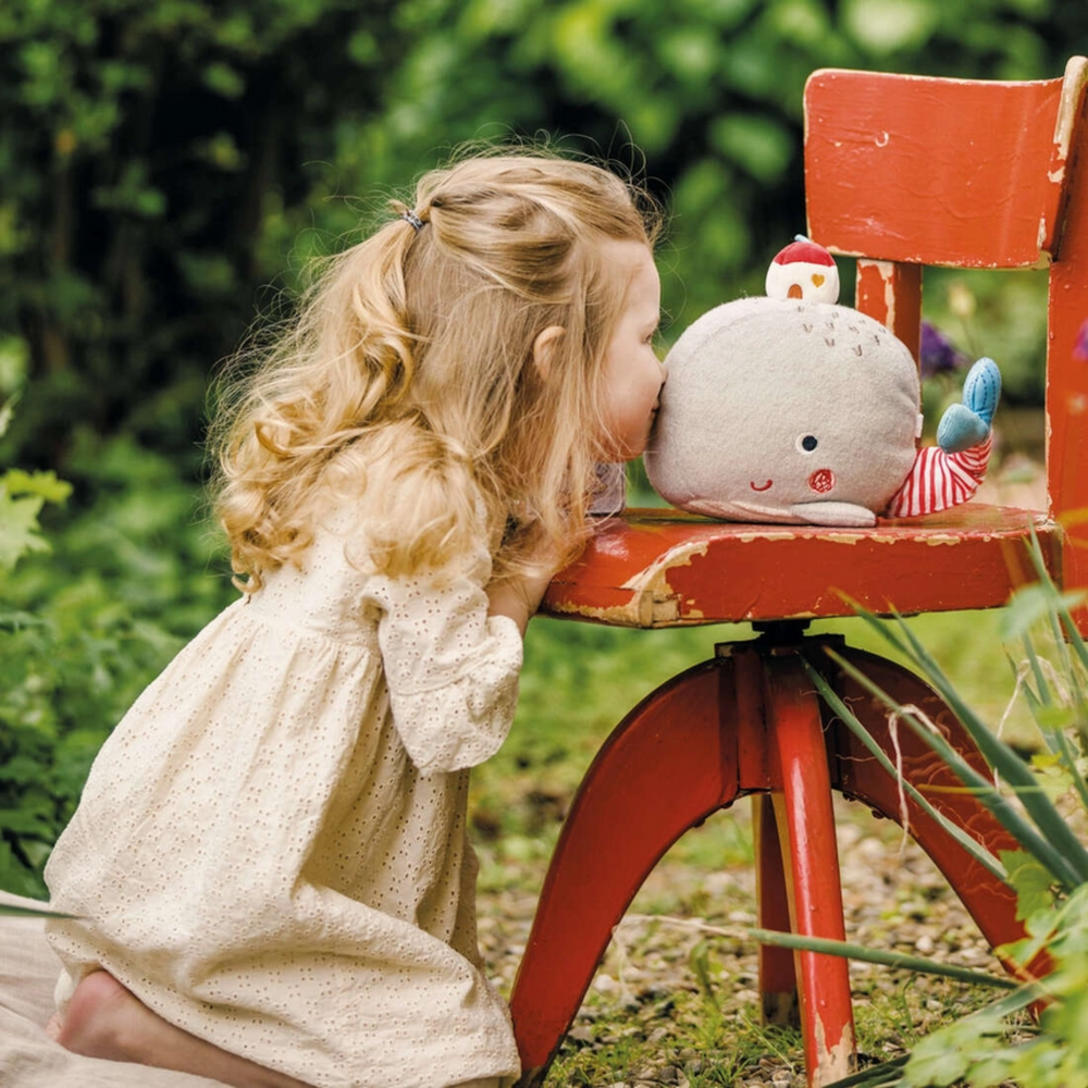 a girl kissing Wilma Best Friend Plush