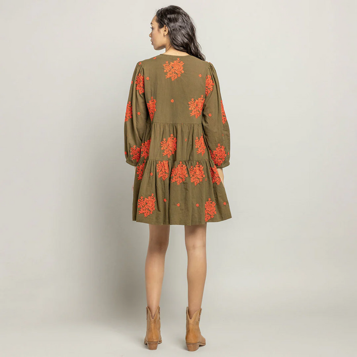 a woman wearing Michelle Dress - Dark Olive W/ Embroidery back