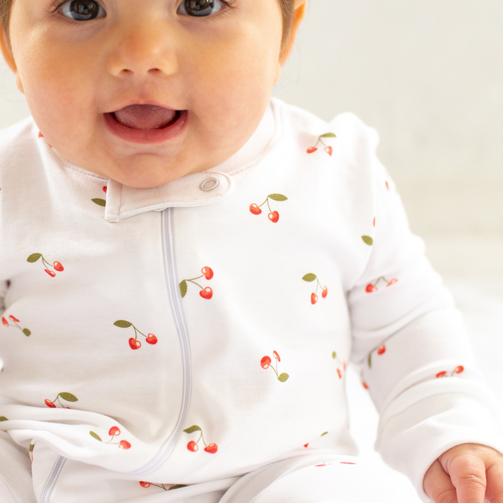 a baby wearing Cheery Cherry Zipper Romper