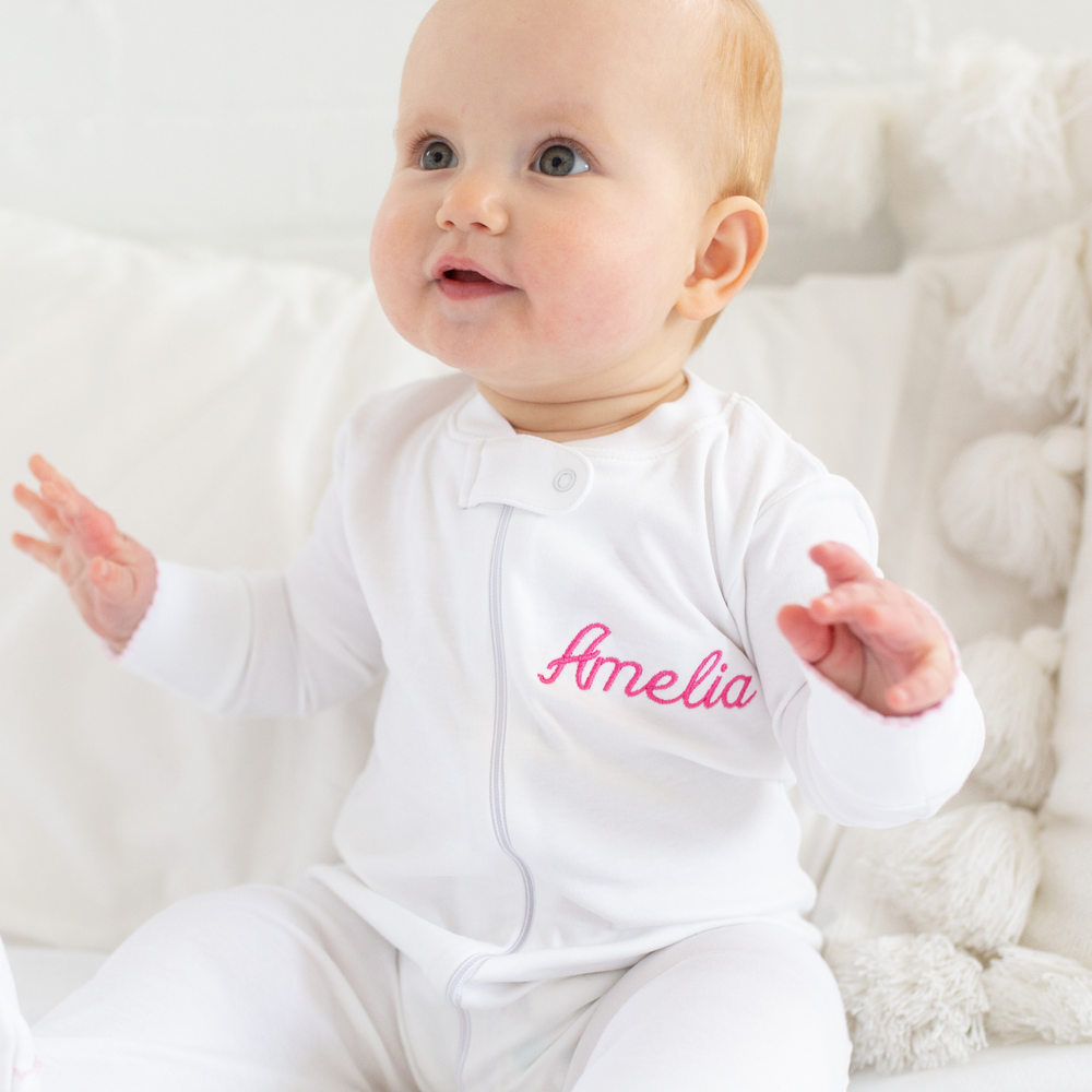 a baby wearing Zipper Romper in White with Light Pink Picot Trim