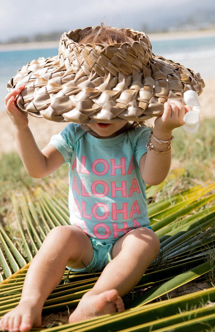 baby girl wearing aloha onesie