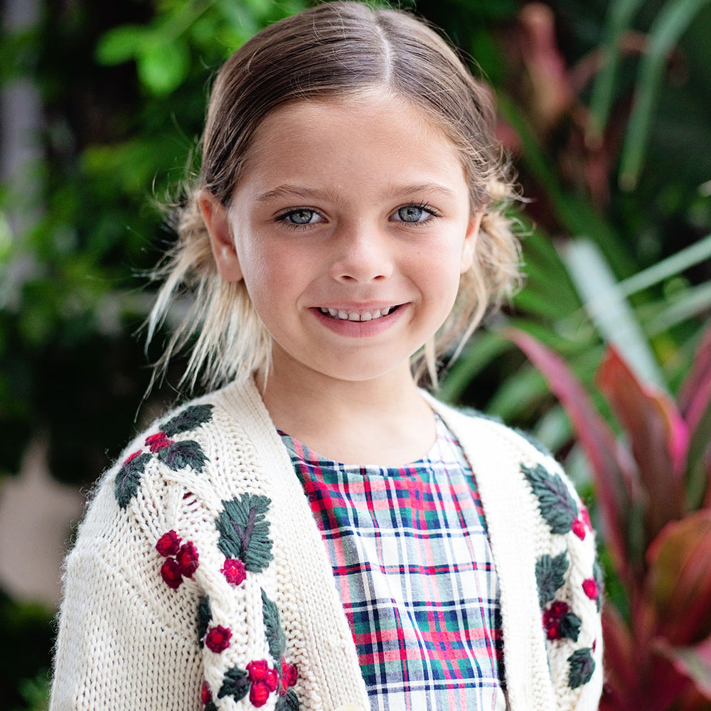 girl wearing holly cardigan