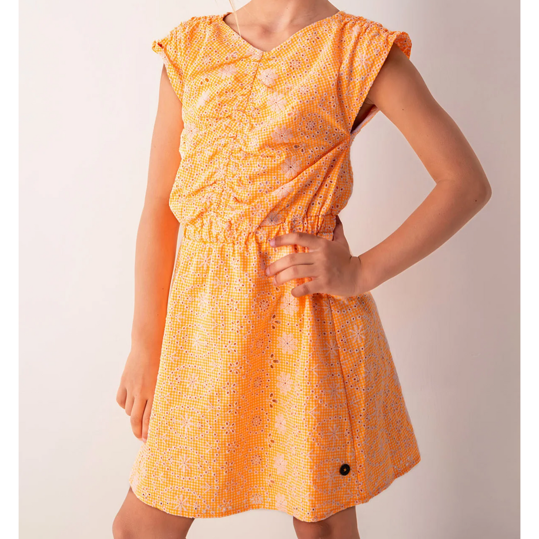 a little girl wearing Thirza Neon Flower Dress