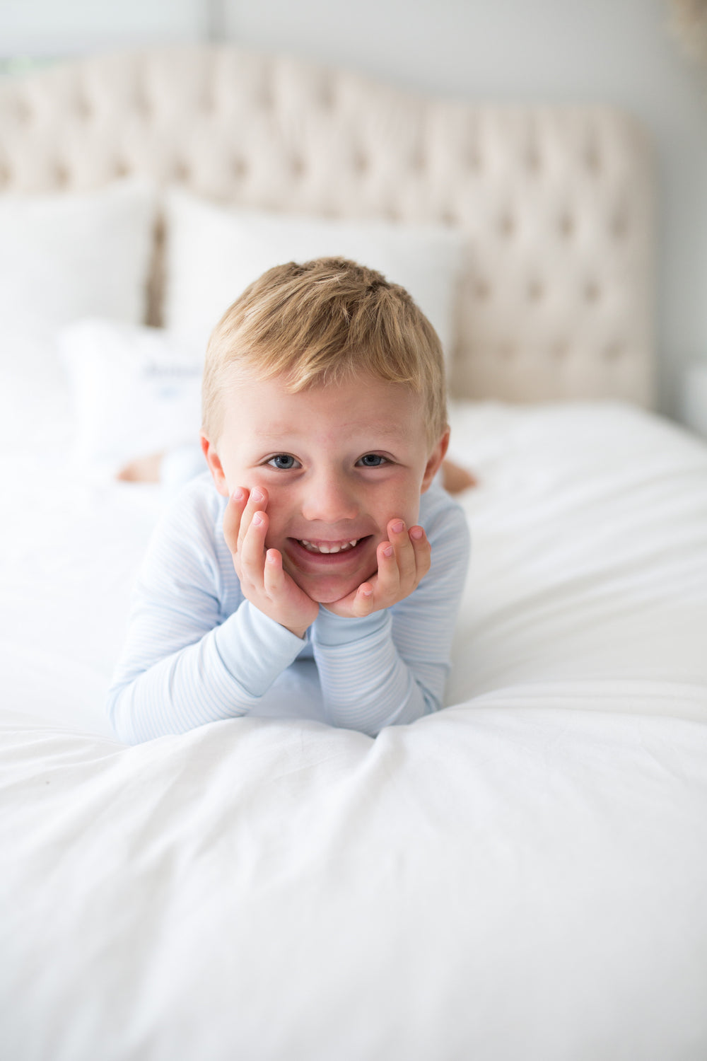 boy wearing blue stripe pajamas