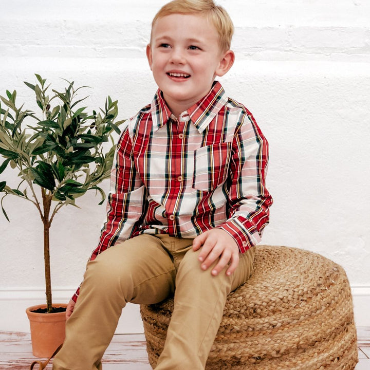 boy wearing red plaid buttondown