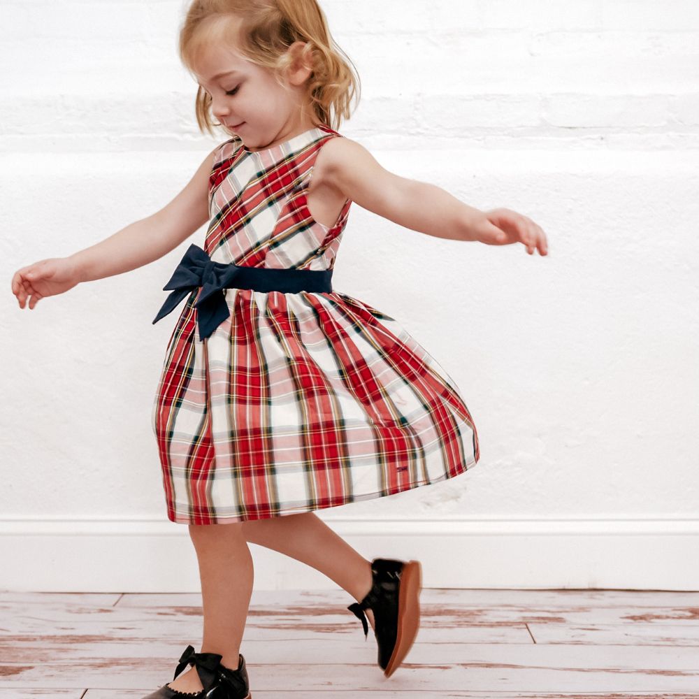 girl wearing red plaid dres