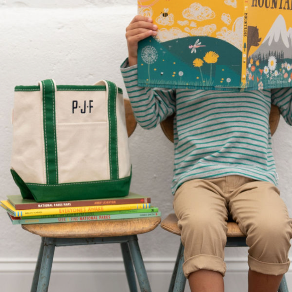 boy on chair with monogram tote