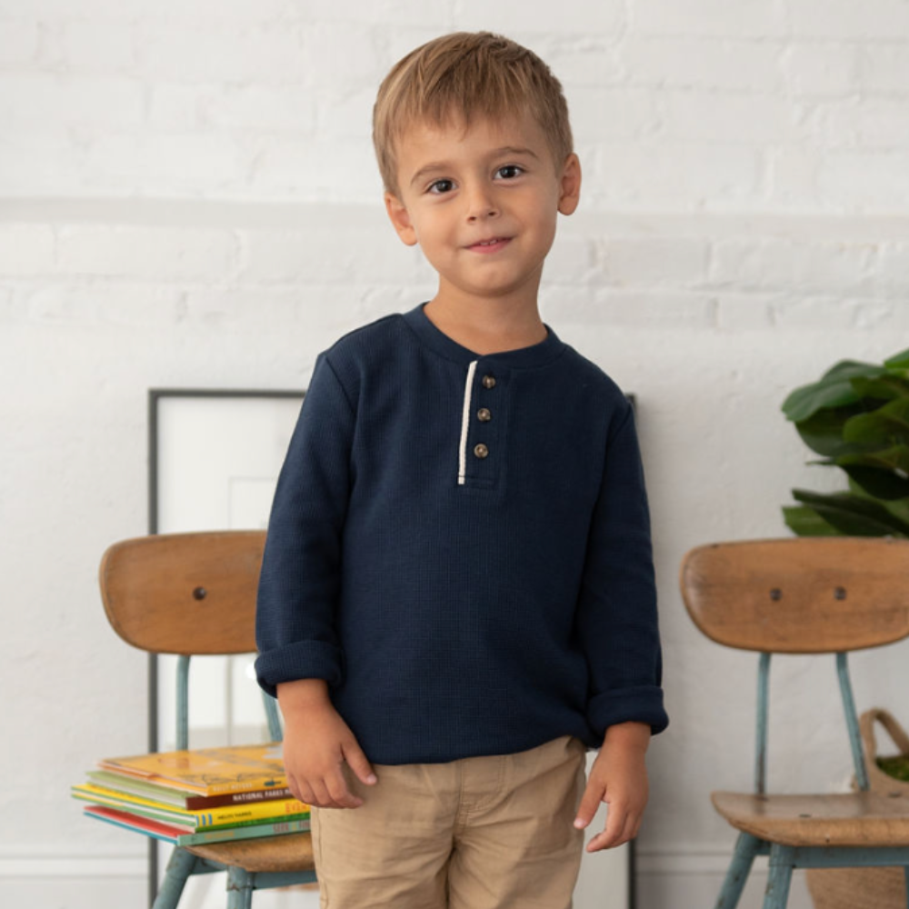 boy wearing blue henley