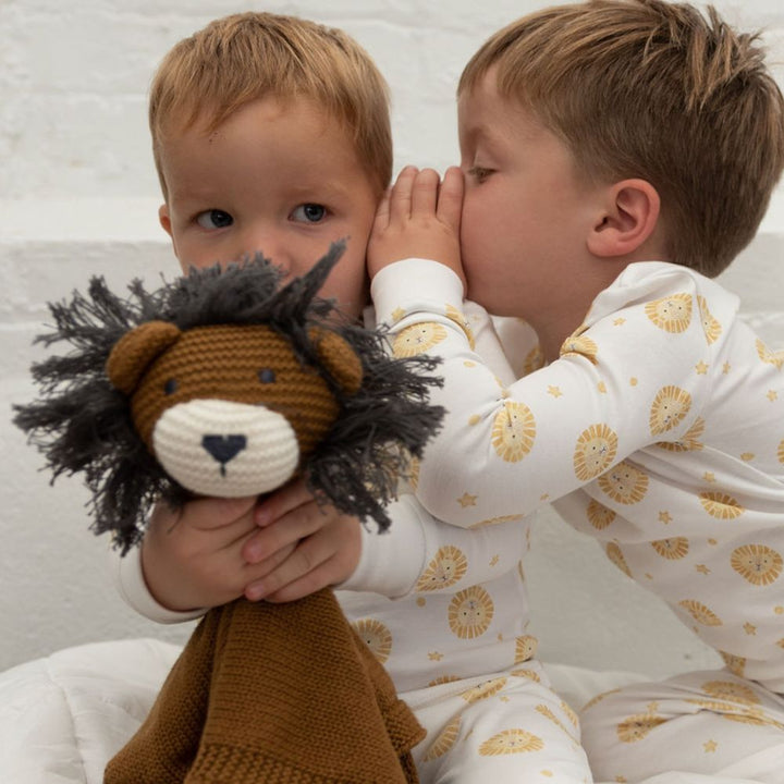 2 little boys holding Organic Lion Lovey in Chestnut