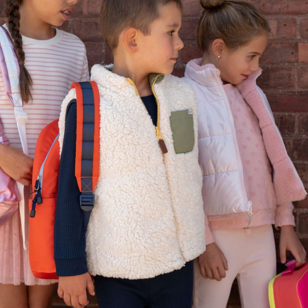 boy wearing sherpa vest