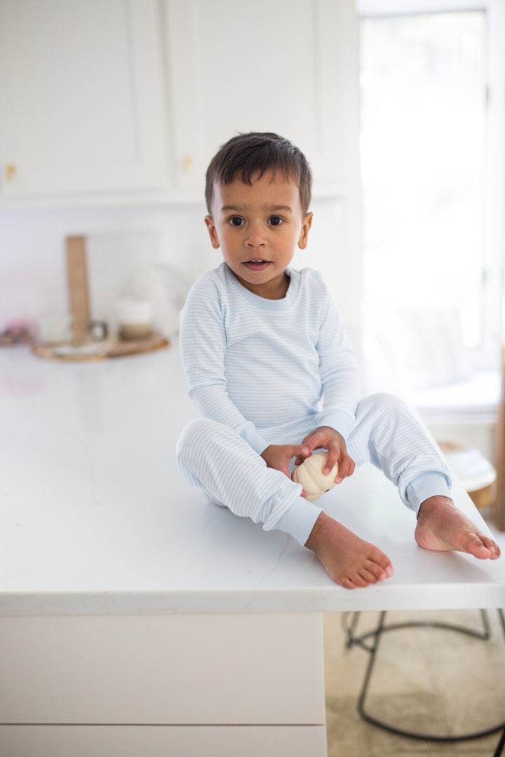 boy wearing light blue pajamas