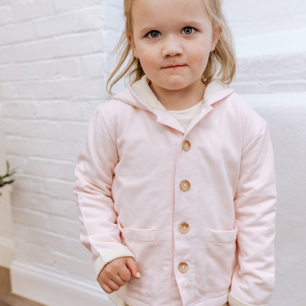 little girl in pink jacket
