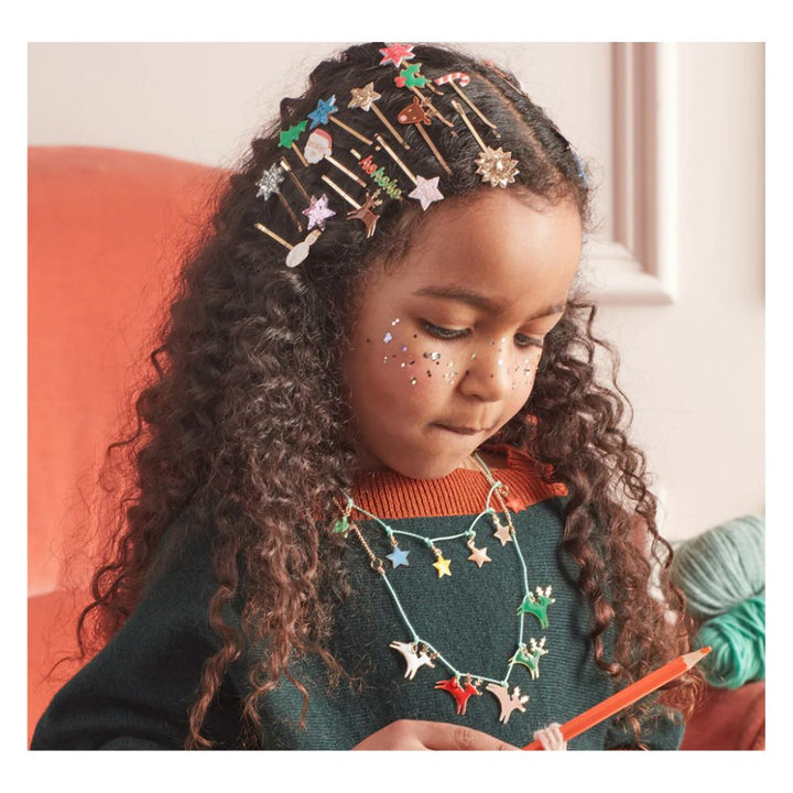 girl wearing stacked hair slides and necklaces