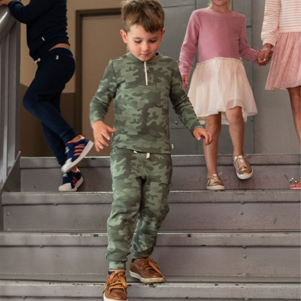 boy wearing camo outfit