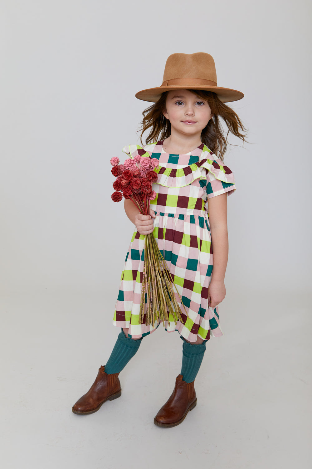 girl wearing plaid dress 