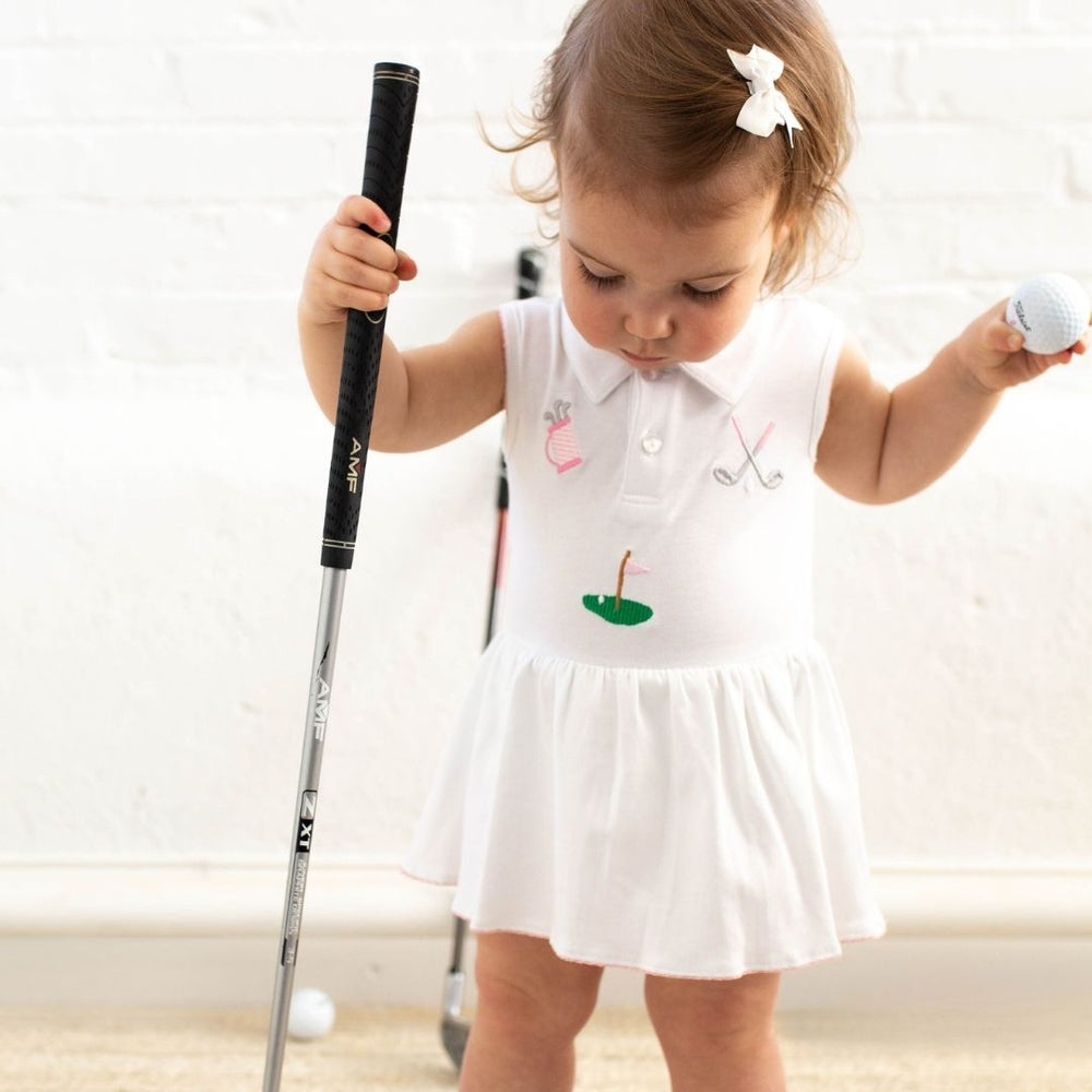 little girl wearing golf riley romper