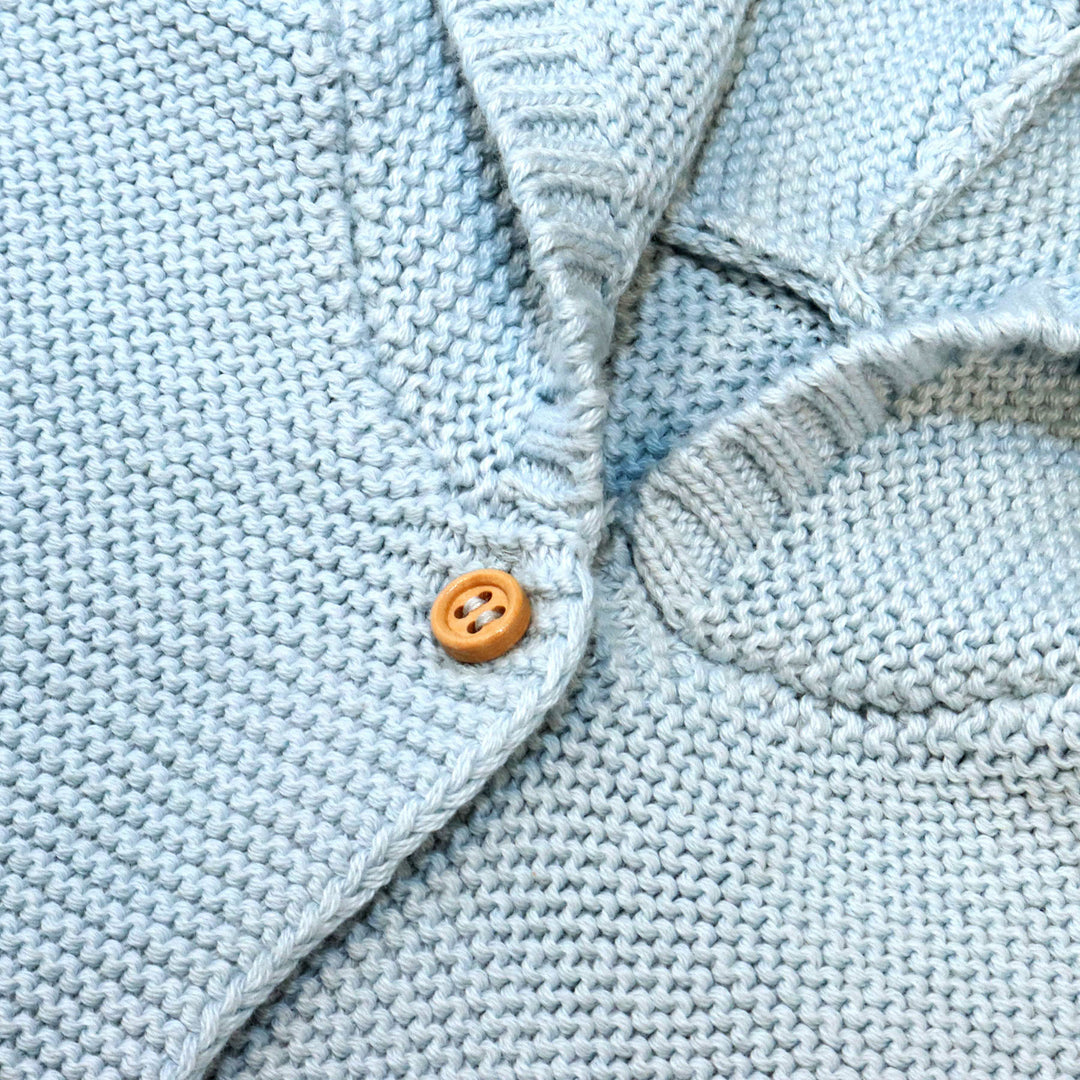 closeup of blue sweater button