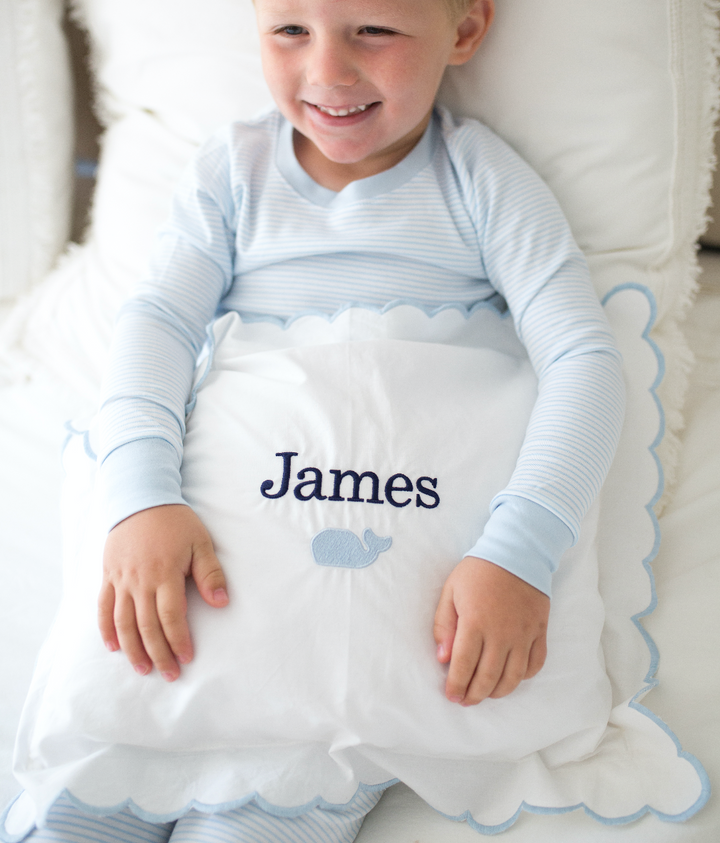 boy with monogrammed pillow