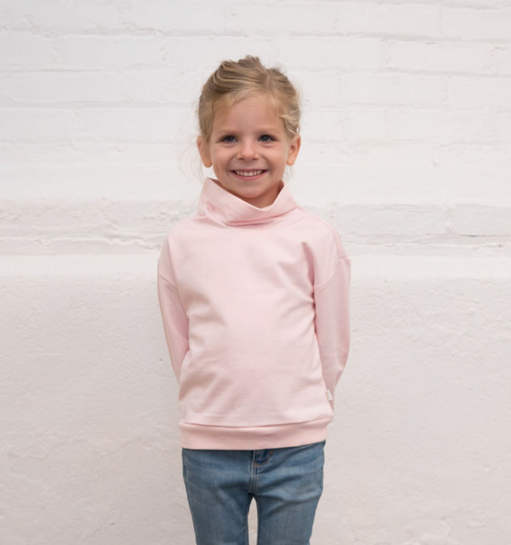 girl wearing pink sweatshirt