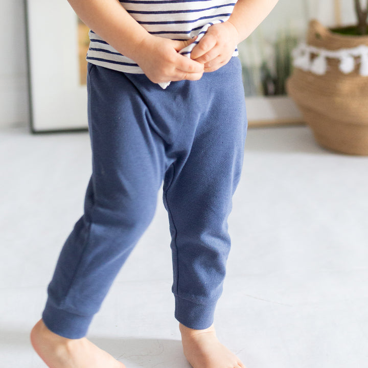 boy wearing navy joggers