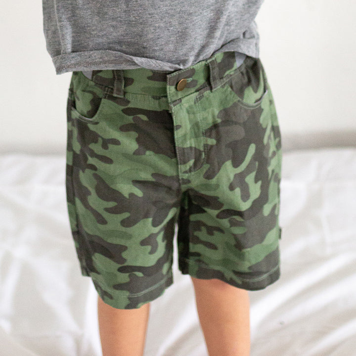 boy wearing camo shorts