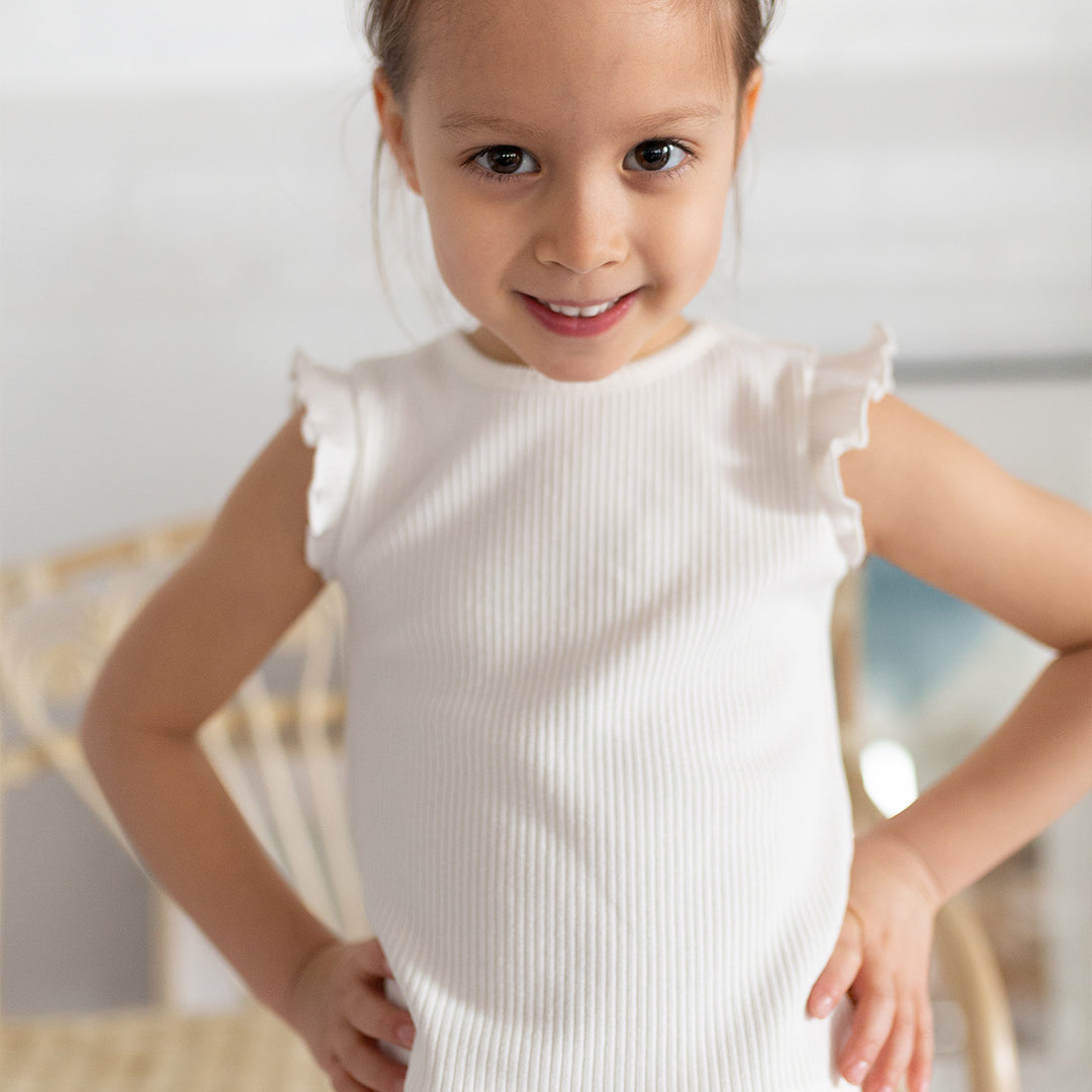 girl wearing ivory tank top