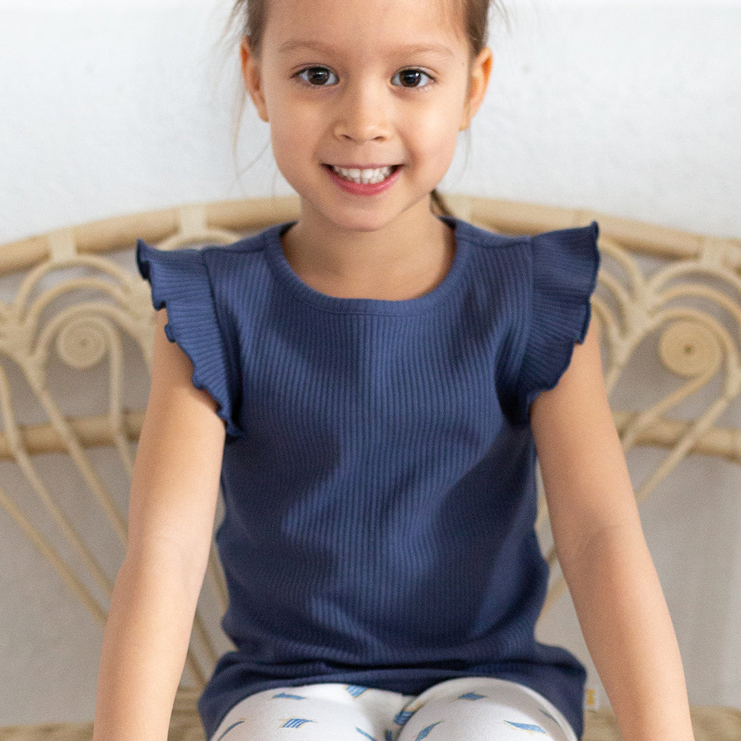 girl wearing navy tank top