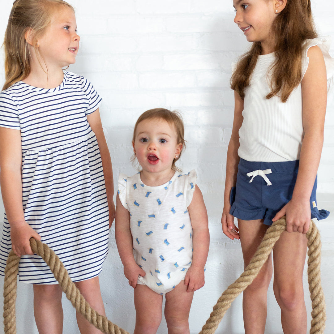 girls wearing striped dress, beach bubble