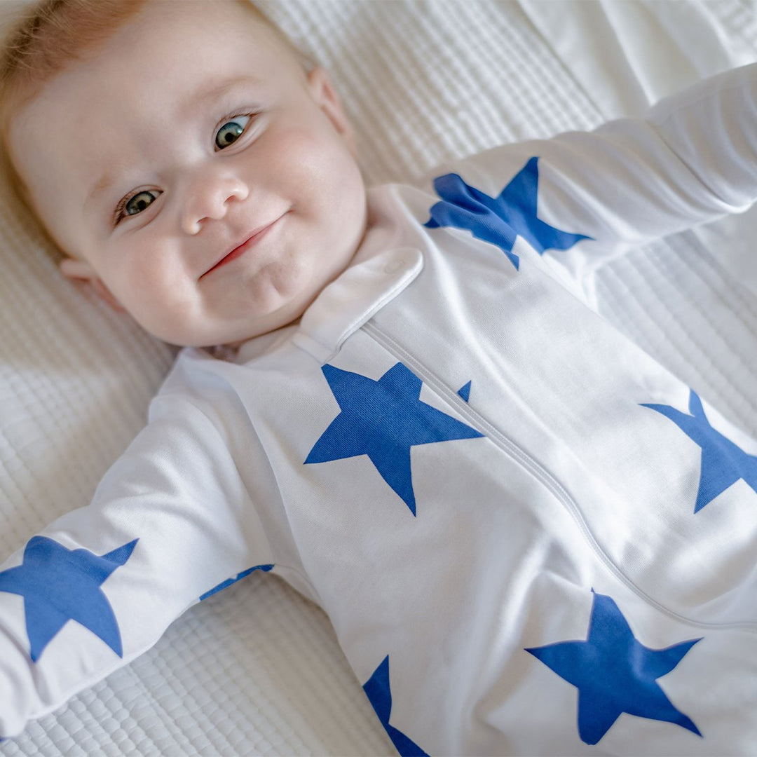 baby wearing blue star zipper romper