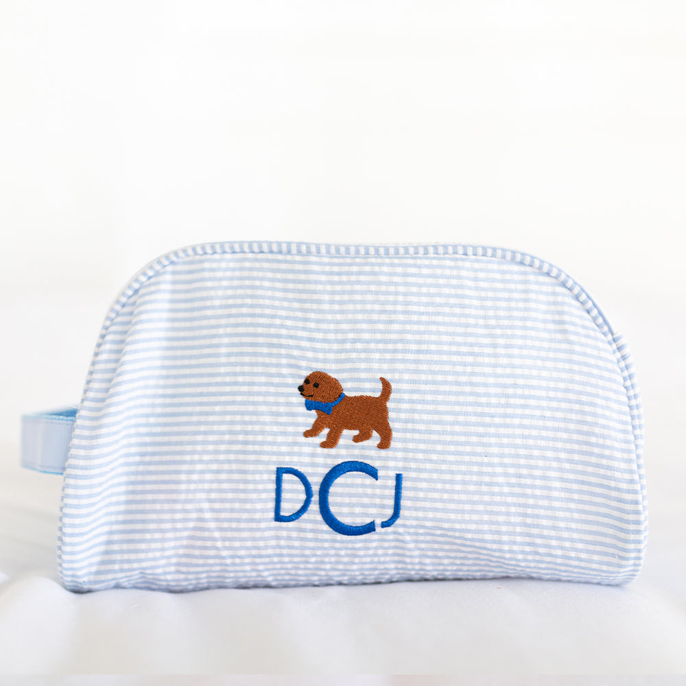 blue monogramed travel pouch