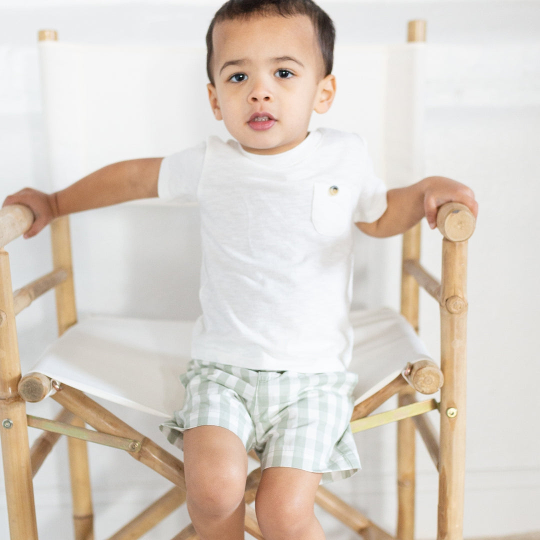 boy wearing gingham shorts