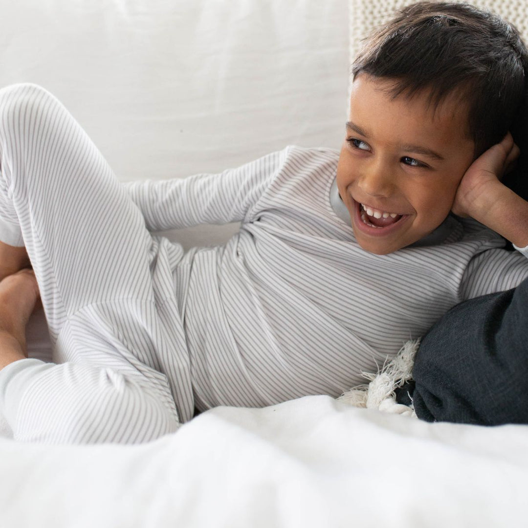 boy wearing grey pajamas