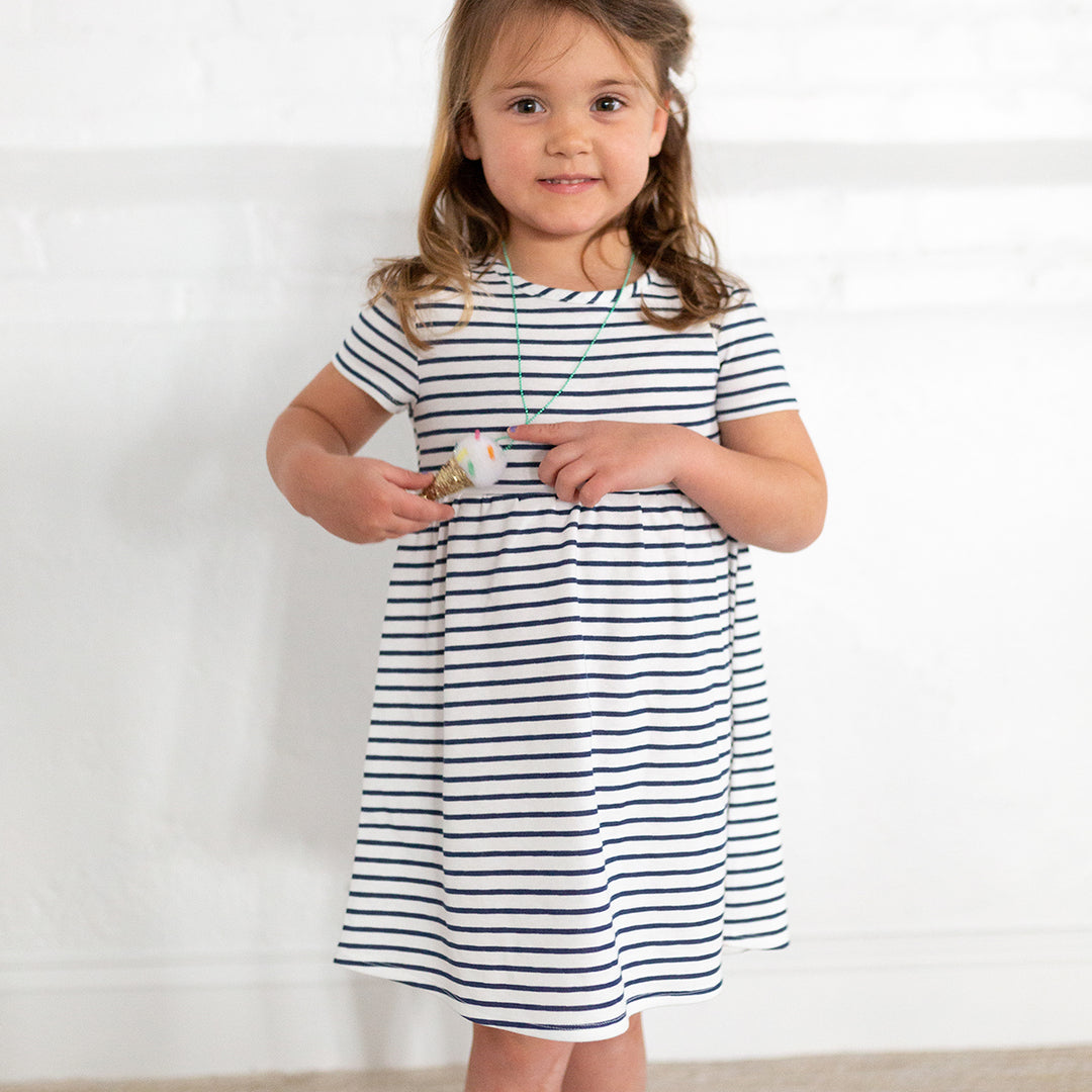 girl wearing navy striped dress