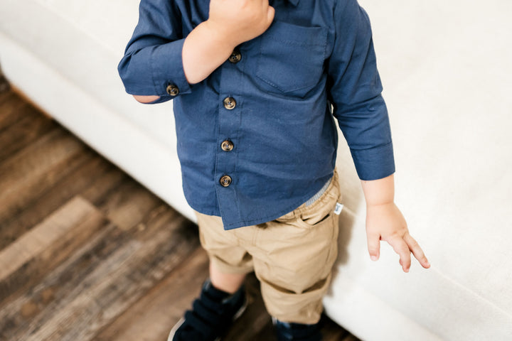 boy wearing navy button down